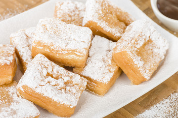 Yum Yum - Sweet toffee flavoured fried pastry dusted with icing sugar.
