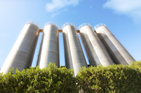 Higher Steel Silos With Green Plants