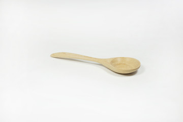Wooden spoon on white background