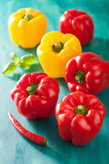 healthy vegetable red yellow peppers on turquoise background