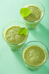 healthy green smoothie with spinach leaves