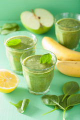 healthy green smoothie with spinach leaves apple lemon banana
