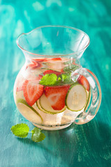 refreshing summer drink with strawberry cucumber lime in jar