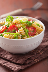 vegetarian pasta fusilli with tomato peas herbs