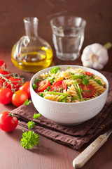 vegetarian pasta fusilli with tomato peas herbs