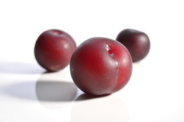 Plums isolated on white.