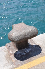 Iron bollard in the port Capri Italy