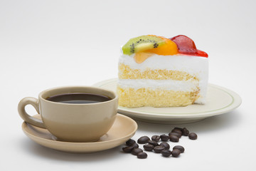 cup of coffee and delicious cake on white background