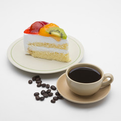 cup of coffee and delicious cake on white background