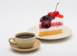 cup of coffee and delicious cake on white background
