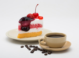 cup of coffee and delicious cake on white background
