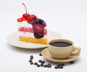cup of coffee and delicious cake on white background
