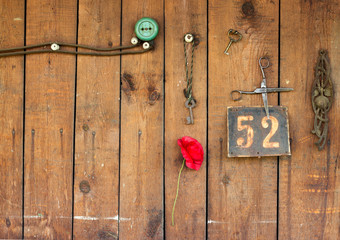 vintage frame and key on wooden wall with power outlet