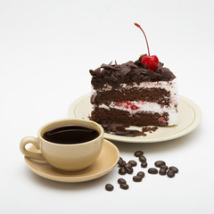 cup of coffee and delicious cake on white background