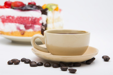 cup of coffee and delicious cake on white background