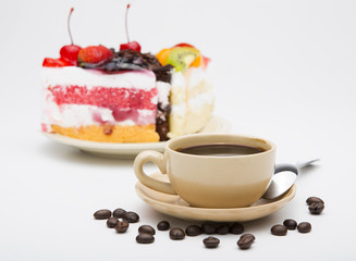 cup of coffee and delicious cake on white background