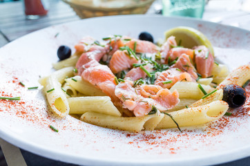 tasty pasta with salmon on a the table