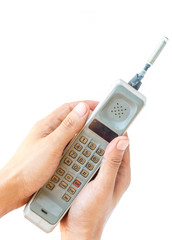 man hand holding vintage mobile phone Isolated on white background.