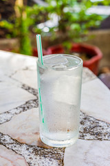 Glass of water on the white table
