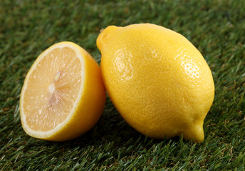 fresh lemon laying on green grass