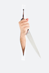 Hand with a knife striking through a tent