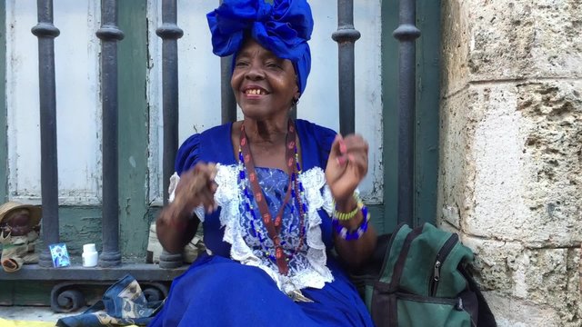 Black Lady Dancing with Cigar in Havana, Cuba
