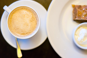 Cup of cappuccino with apple strudel and ice cream
