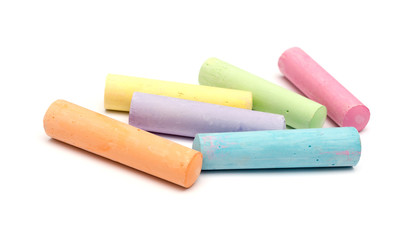 chalks in a variety of colors arranged on a white background - 87915916