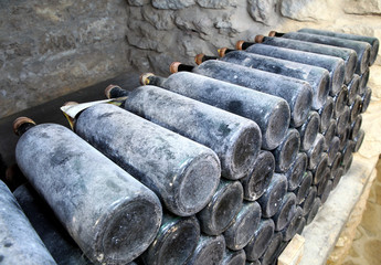 The ancient bottles of wine in the ancient cellar.