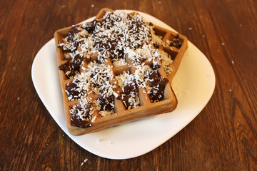 chocolate wafer with chocolate and coconut close up, captured with a small depth of field