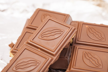 Chocolate bar in foil isolated on white background