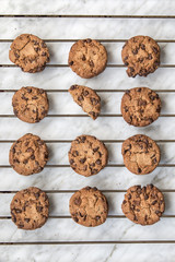 Homemade chocolate cookies over white marble background