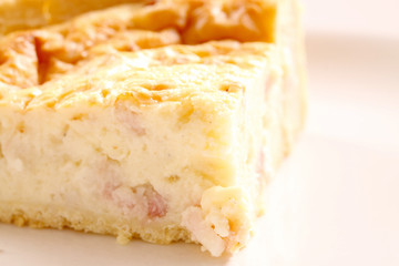 Quiche Lorraine.
A piece of Quiche Lorraine on a plate.