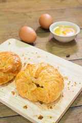 Croissants on wooden background