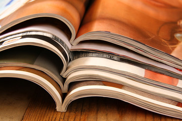 stack of printed magazines
