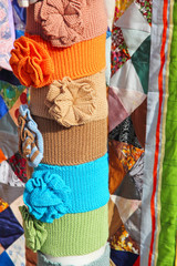 Color clothing accessory and multicolored patchwork quilt.