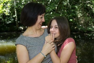 Mother and girl have fun together at park