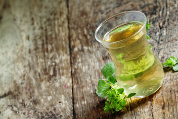 Herbal tea with oregano, selective focus