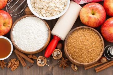 ingredients for baking cake on a wooden background, close-up