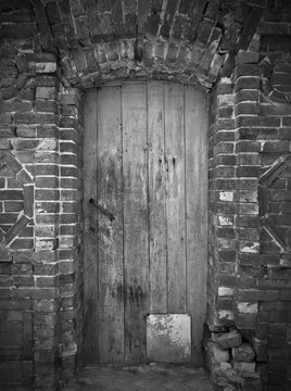 old wooden door black and white photo