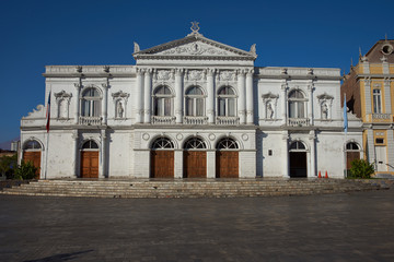 White classical style theatre in Plaza Arturo Prat in the old quarter of Iquique on the Pacific coast of northern Chile.