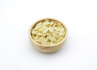 Almond slices in wooden bowl on white background
