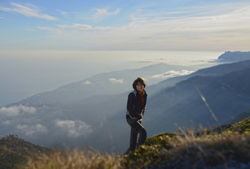 Fototapeta premium Hiker above clouds
