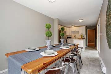 extraordinary  dinning room with grey walls and long table.