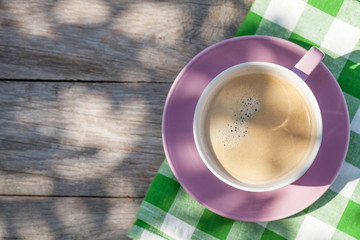 Coffee cup on garden table