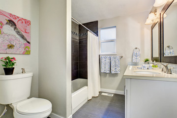 Modernized bathroom with tile floor.