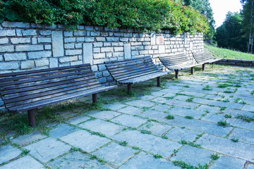 wooden park bench at a park