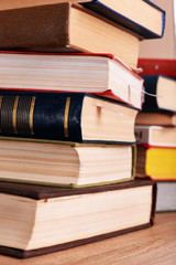 Stacks of books on table close up