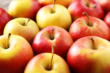 Red apples on grey wooden background