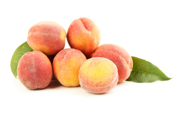 Fresh peaches fruit isolated on a white